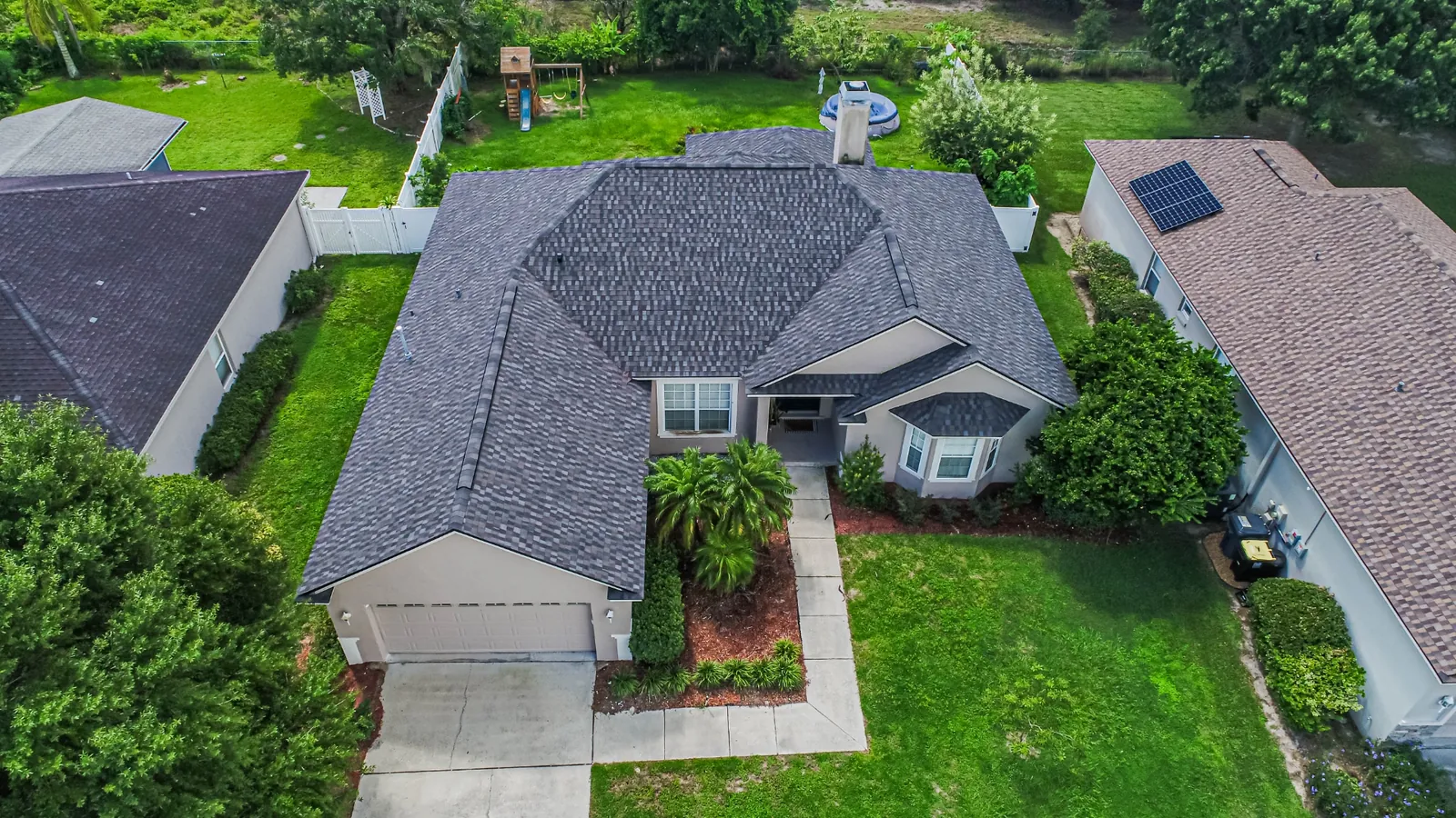 Aerial view of a Stronghold architectural shingle roof on a Florida two-story home