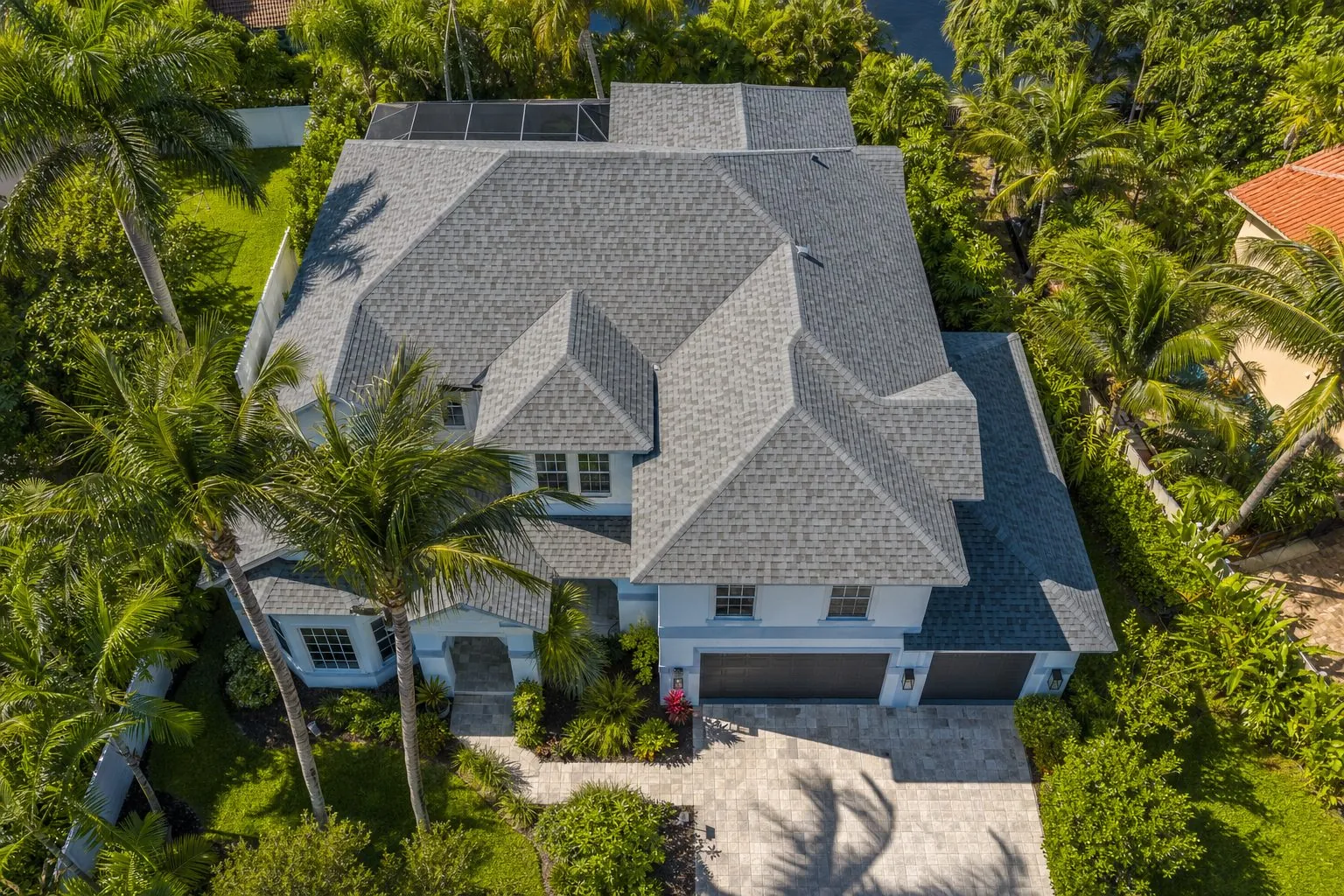 A close aerial view of a completed gray architectural-shingle roof