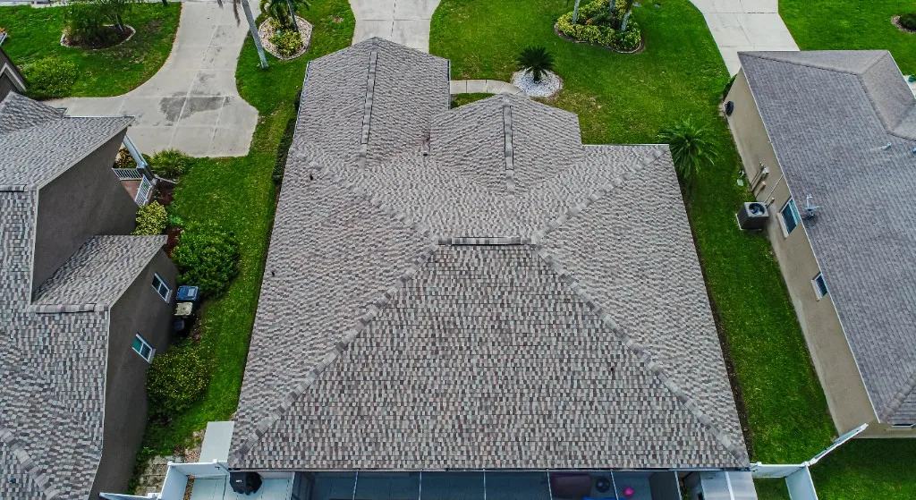 Stronghold Roofing installed a tan shingle roof on a ranch-style home in Brandon, FL.