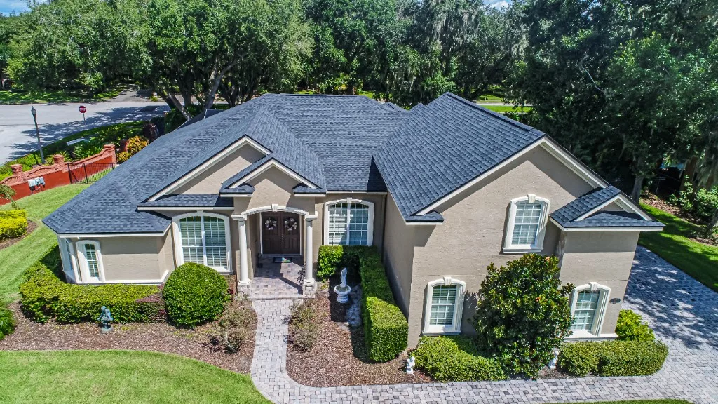 Stronghold Roofing installed a charcoal shingle roof on this two-story home in Clearwater, FL.