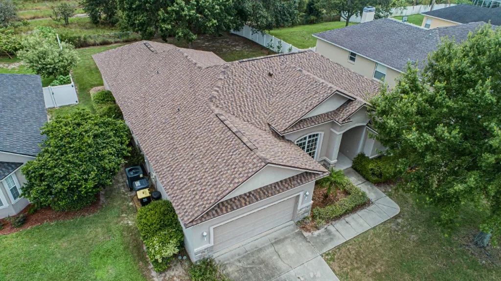 Stronghold Roofing installed a brown shingle roof on a ranch style home in Fort Myers, FL.