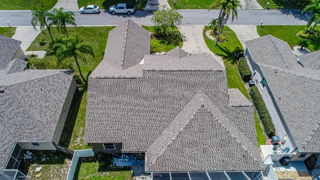 Stronghold Roofing completed a light brown shingle roof on a ranch-style home in St. Petersburg, FL.