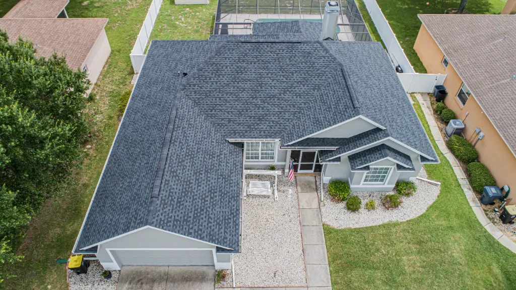 Stronghold Roofing installed a dark gray shingle roof on a ranch-style home in Tampa, FL.