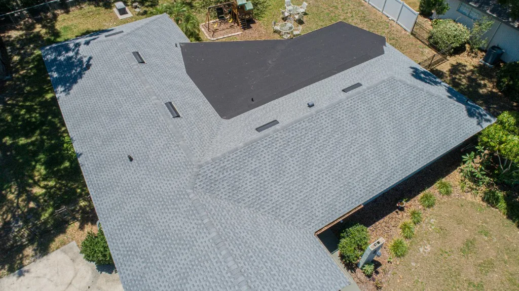Stronghold Roofing completed a gray shingle roof with a black flat section in Winter Haven, FL.
