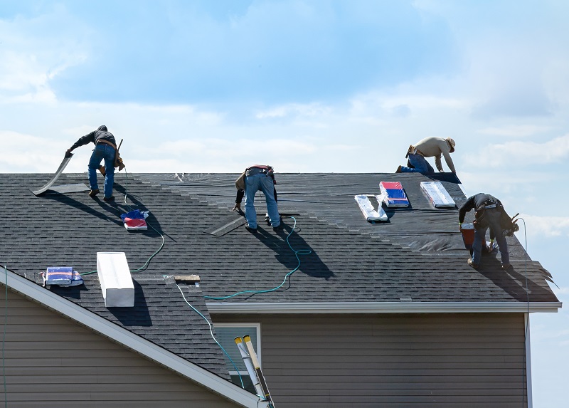 Pro roofers working on a roof