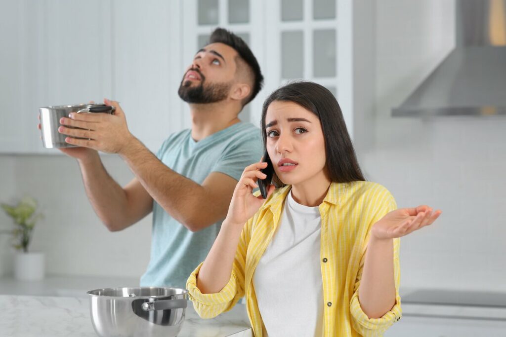 A woman calling roof company for roof emergency in Lakeland, FL