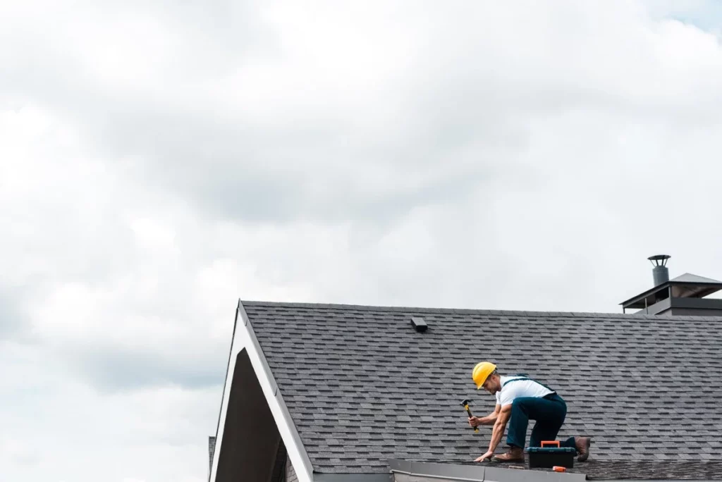 A roofer repairing a small roof in Lakeland 