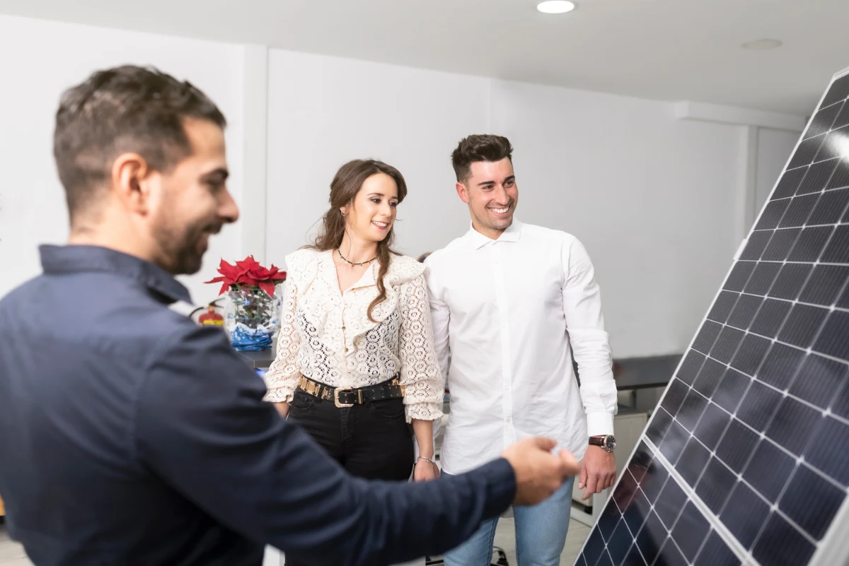A couple deciding to have solar panels or solar shingles