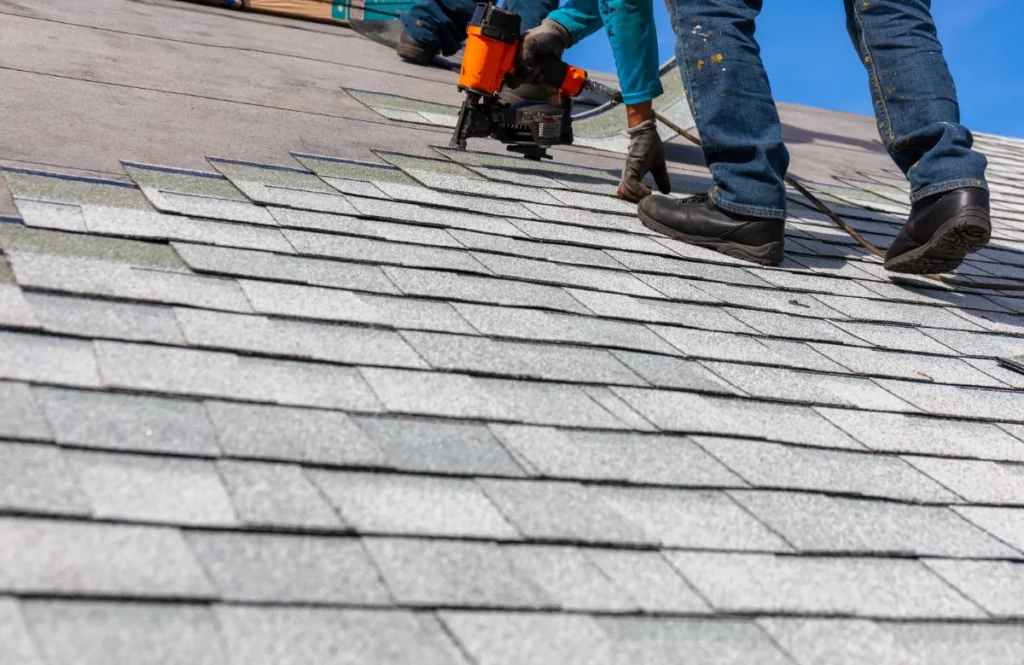 Roofers installing new roof materials