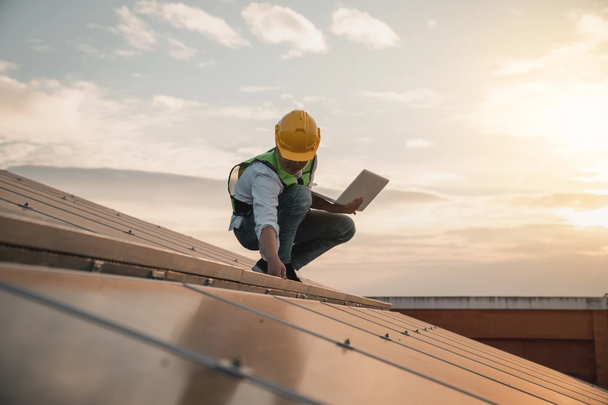 a roofer inspecting commercial roof in Florida