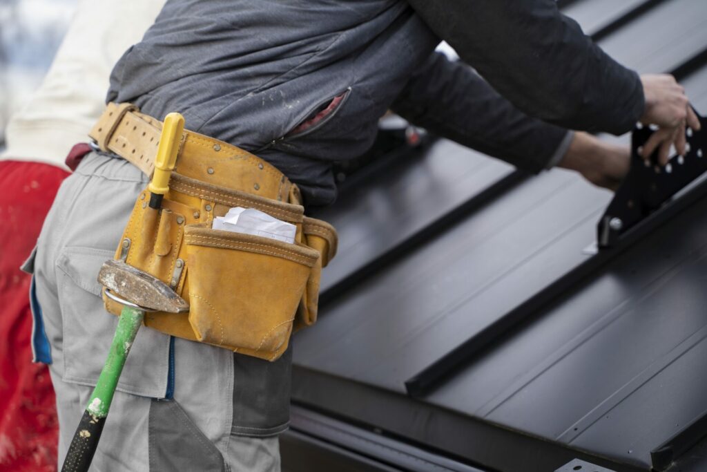 Construction worker doing his job with belt