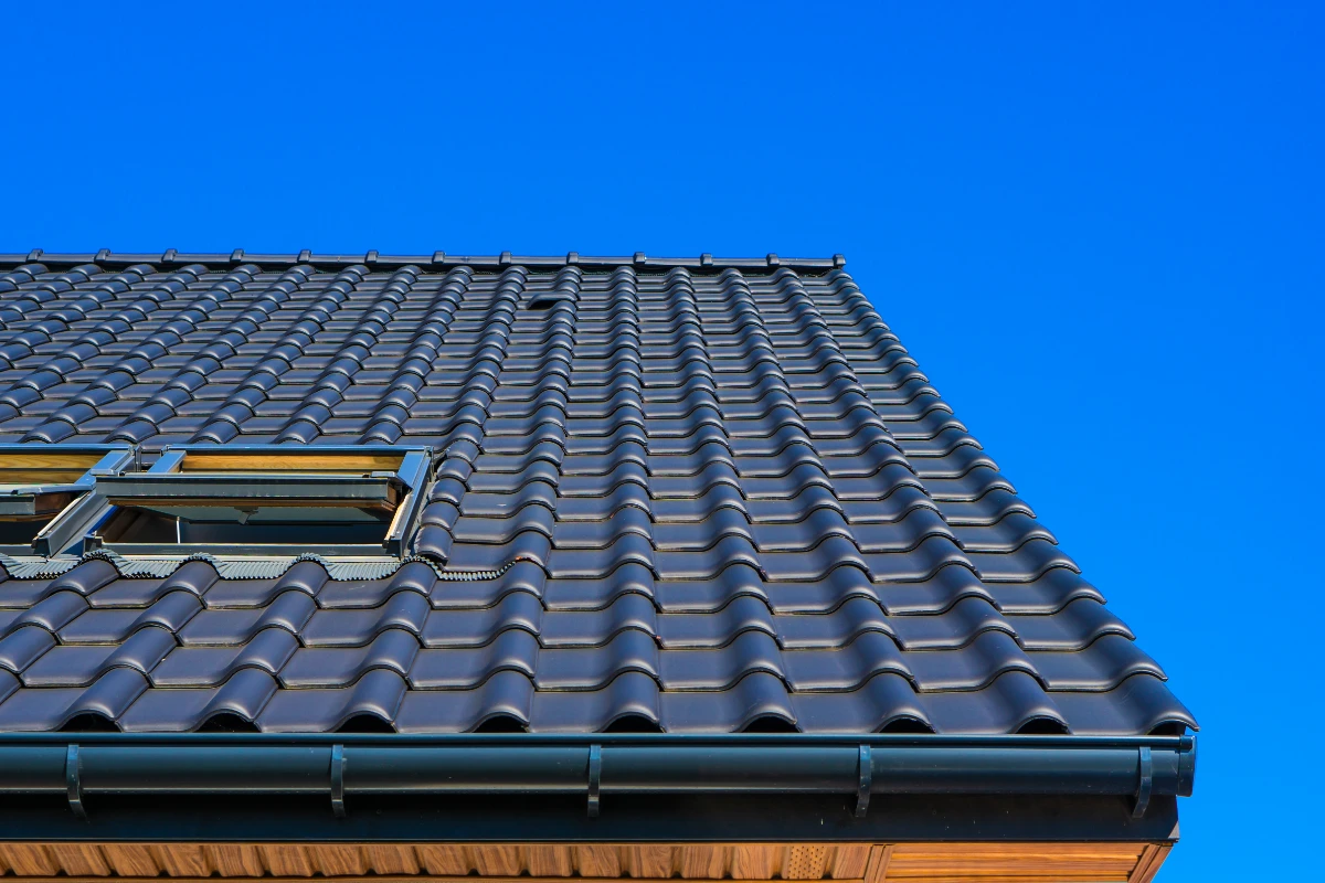 vertical low angle closeup shot of the black roof of a building