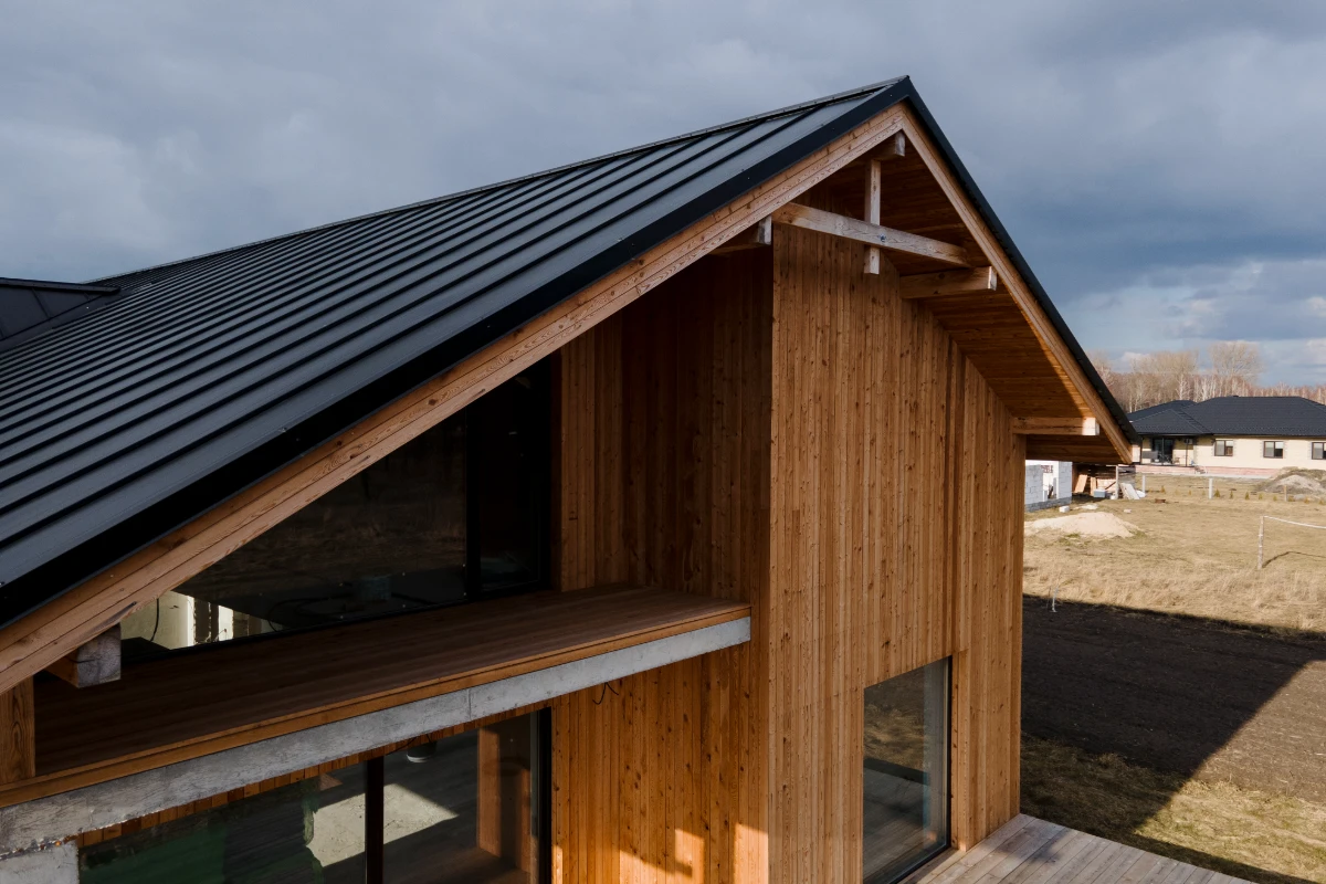 wooden house with dark roof