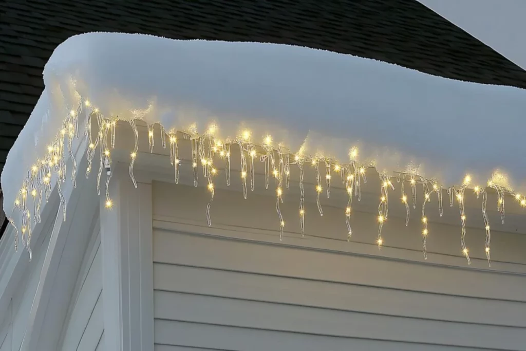 clean whitestyle image row christmas lights strung along snowy roofline